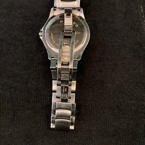 Movado men masino blue, light ware on bezel crystal is in great shape watch
